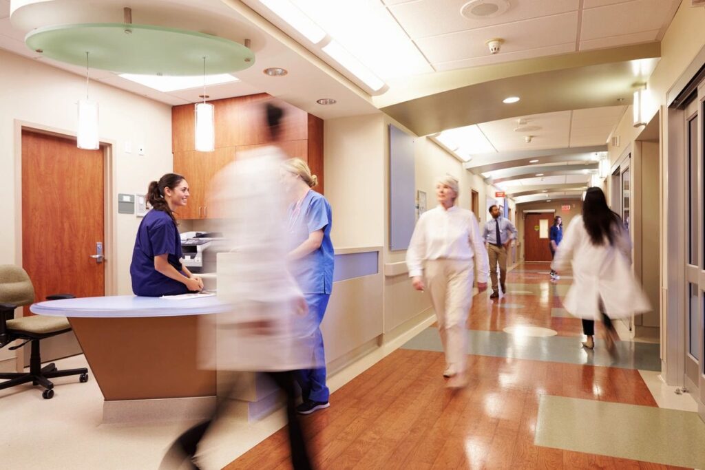 Healthcare clinic entrance in Fresno with a badge reader access control panel highlighting the need for unified security systems across multi-site medical practices