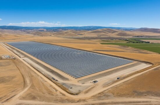 Utility-scale solar farm under construction in the Central Valley with rows of panel racking stretching across thousands of acres of flat agricultural land showing the massive surveillance challenge